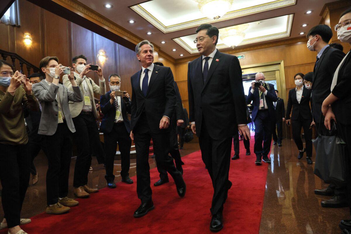U.S. Secretary of State Antony Blinken (L) walks with China's Foreign Minister Qin Gang (R) ahead of a meeting at the Diaoyutai State Guesthouse in Beijing on June 18, 2023. (Leah Millis/Pool/AFP via Getty Images)