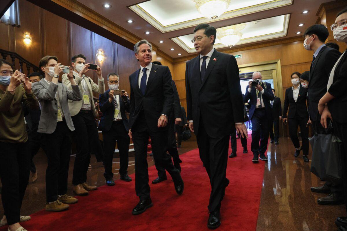 U.S. Secretary of State Antony Blinken walks with China's then-Foreign Minister Qin Gang ahead of a meeting at the Diaoyutai State Guesthouse in Beijing on June 18, 2023. (Leah Millis/Pool/AFP via Getty Images)