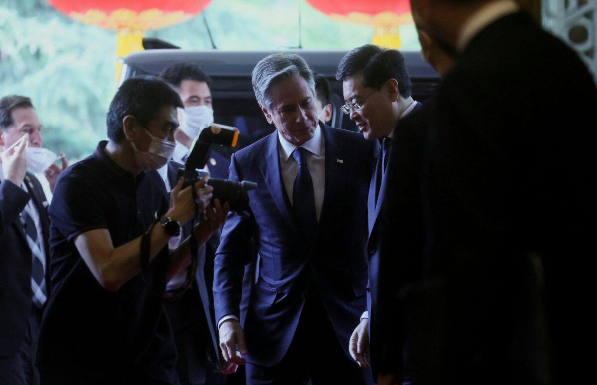 U.S. Secretary of State Antony Blinken (C) greets China's Foreign Minister Qin Gang (R) ahead of a meeting at the Diaoyutai State Guesthouse in Beijing on June 18, 2023. (Leah Millis / POOL / AFP via Getty Images)