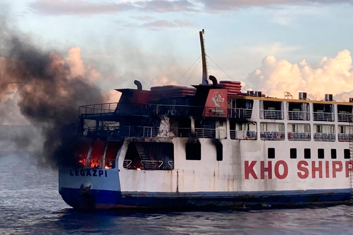 Smoke comes out from Philippine ferry M/V Esperanza Star as it caught fire at the waters off Panglao, Bohol province, central Philippines, on June 18, 2023. (Philippine Coast Guard via AP)