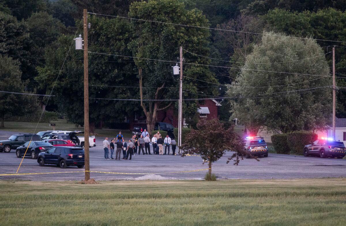 Authorities gather at the scene of a shootout between Pennsylvania State Troopers and a gunman near Mifflintown, Pa., on June 17, 2023. (Sean Simmers/The Patriot-News via AP)