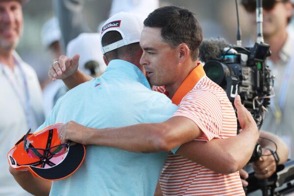 Rickie Fowler congratulates Wyndham Clark, both of the United States, on the 18th green following the final round of the 123rd U.S. Open Championship at The Los Angeles Country Club in Los Angeles on June 18, 2023. (Sean M. Haffey/Getty Images)