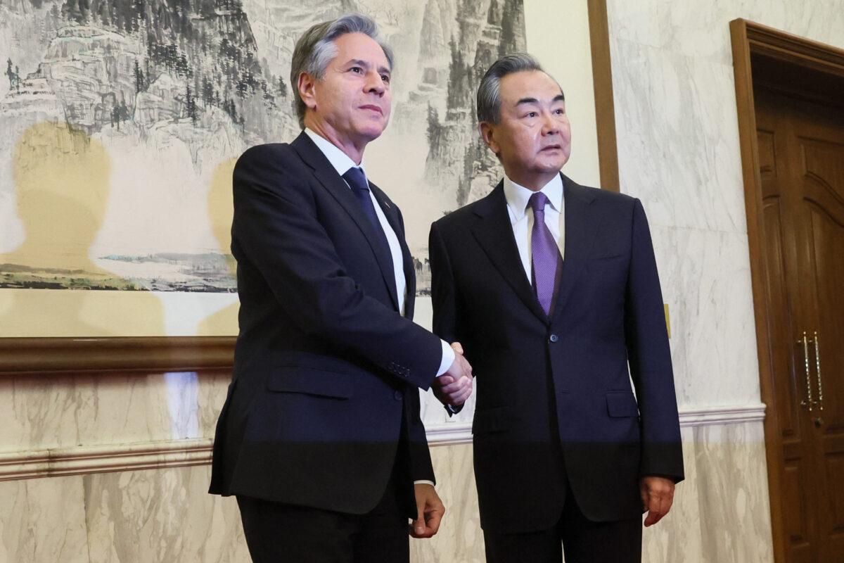 U.S. Secretary of State Antony Blinken (L) shakes hands with China's Director of the Office of the Central Foreign Affairs Commission Wang Yi at the Diaoyutai State Guesthouse in Beijing on June 19, 2023. (Leah Millis/POOL/AFP via Getty Images)