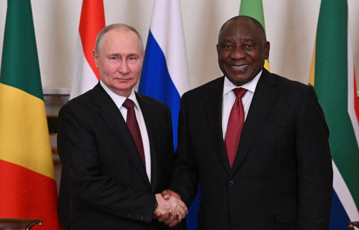 Russian President Vladimir Putin and South African President Cyril Ramaphosa (R) pose for a photo during a meeting in St. Petersburg, Russia, on June 17, 2023. (Evgeny Biyatov/RIA Novosti via AP)