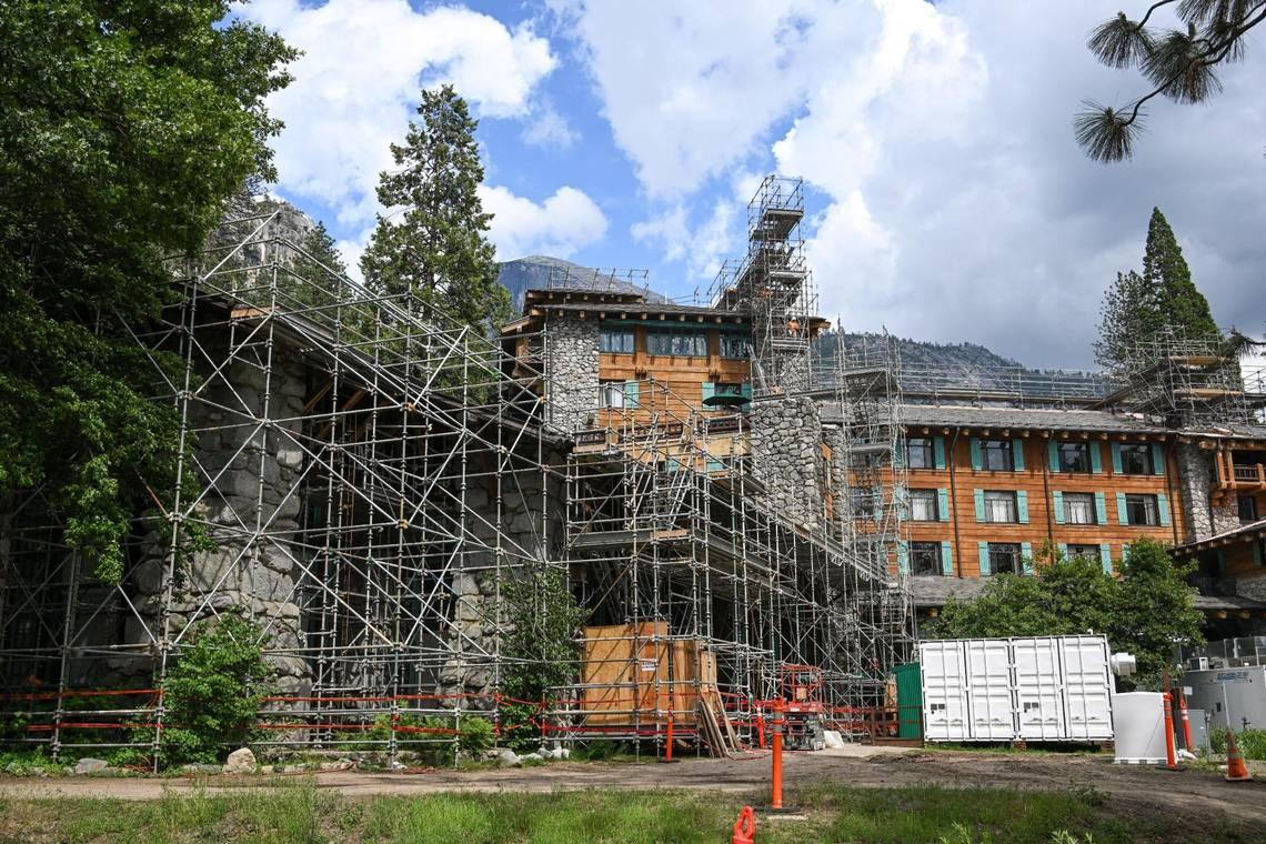 Scaffolding covers the Ahwahnee Hotel during construction on structural enhancements in Yosemite Valley on Tuesday, June 14, 2023. Construction is expected to be completed by the fall. (Craig Kohlruss/The Sacramento Bee/TNS)