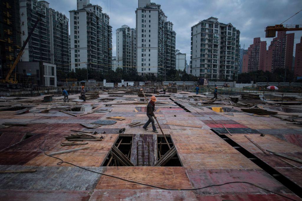 A man works at a construction site of a residential skyscraper in Shanghai on Nov. 29, 2016. (Johannes Eisele/AFP via Getty Images)