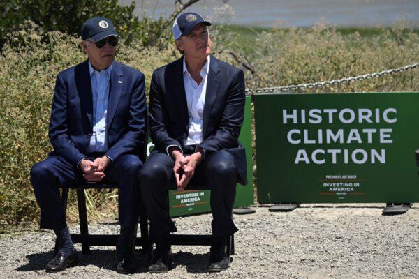 President Joe Biden (L) and California Gov. Gavin Newsom listen to a speaker as the president waits to deliver remarks on his administration's environmental efforts at the Lucy Evans Baylands Nature Interpretive Center and Preserve in Palo Alto, Calif., on June 19, 2023. (Andrew Caballero-Reynolds/AFP via Getty Images)