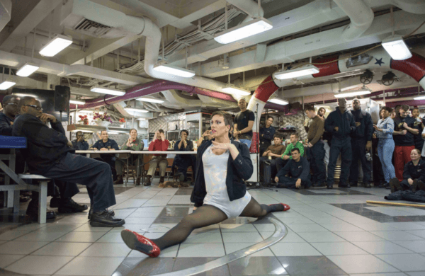 YN3 Joshua Kelley performs for sailors aboard the carrier USS Ronald Reagan in 2017. (MC3 Tyler D. John/Navy)