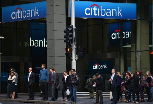 People walk in front of a branch of CitiBank in the central business district of Sydney, in Sydney, Australia, on Aug. 12, 2014. (Peter Parks/AFP via Getty Images)