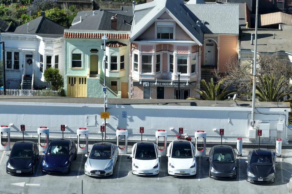 Tesla cars recharge at a Tesla Supercharger station in San Francisco, Calif., on Feb. 15, 2023. (Justin Sullivan/Getty Images)