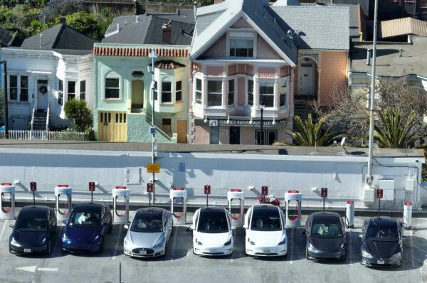 Tesla cars recharge at a Tesla Supercharger station in San Francisco on Feb. 15, 2023. (Justin Sullivan/Getty Images)