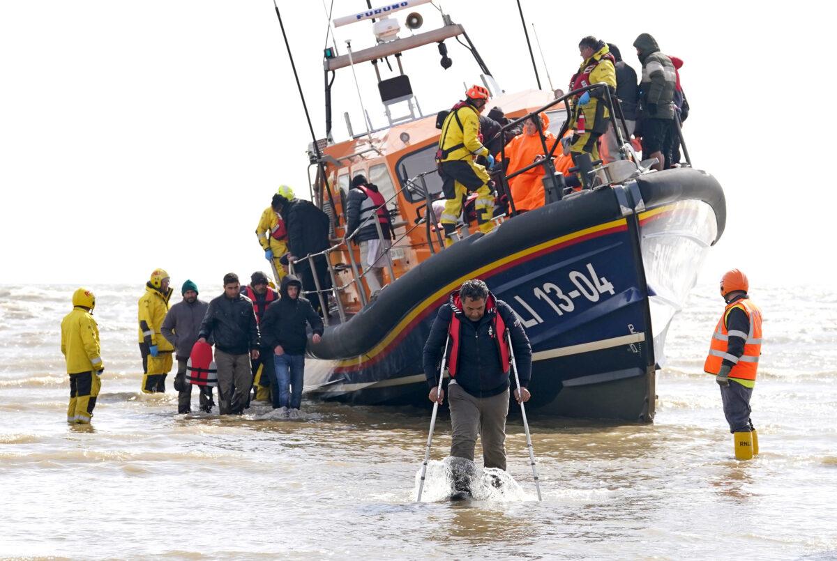 A group of people thought to be illegal immigrants are brought in to Dungeness, Kent, from the RNLI Dungeness Lifeboat, following a small boat incident in the Channel, on April 27, 2023. (Gareth Fuller/PA Wire)