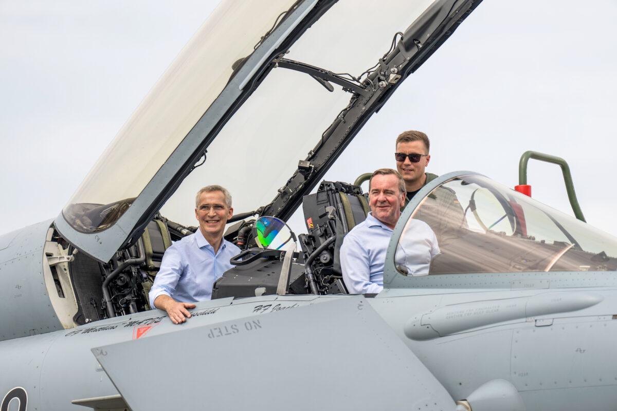 German Defense Minister Boris Pistorius (C) and NATO Secretary General Jens Stoltenberg (L) sit in a Eurofighter Typhoon during their visit to the NATO Air Defender 2023 exercise in Jagel, Germany, on June 20, 2023. (Martin Ziemer/Getty Images)