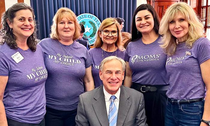 Texas Gov. Greg Abbott (C) poses for a photo with members of Moms for America on April 11, 2023. (Courtesy of Moms for America)