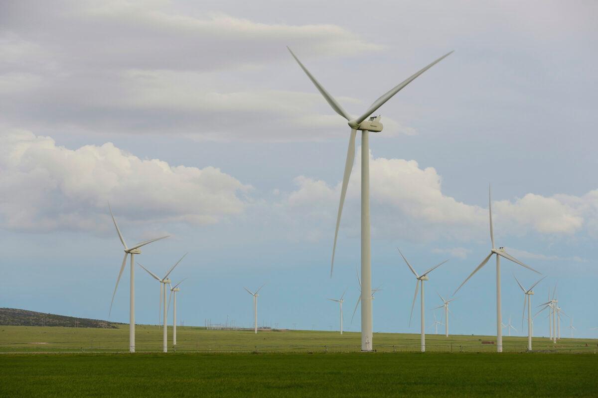 Wind turbines stand at a wind farm along the Montana-Wyoming state line on June 13, 2022. (Emma H. Tobin/AP Photo)