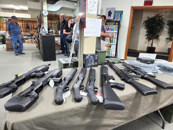 Various firearms are on display at Highwood Creek Outfitters in Great Falls, Mont., on June 20, 2023. IRS Criminal Division agents raided the gun shop on June 14, seizing boxes filled with private gun owner information. (Allan Stein/The Epoch Times)