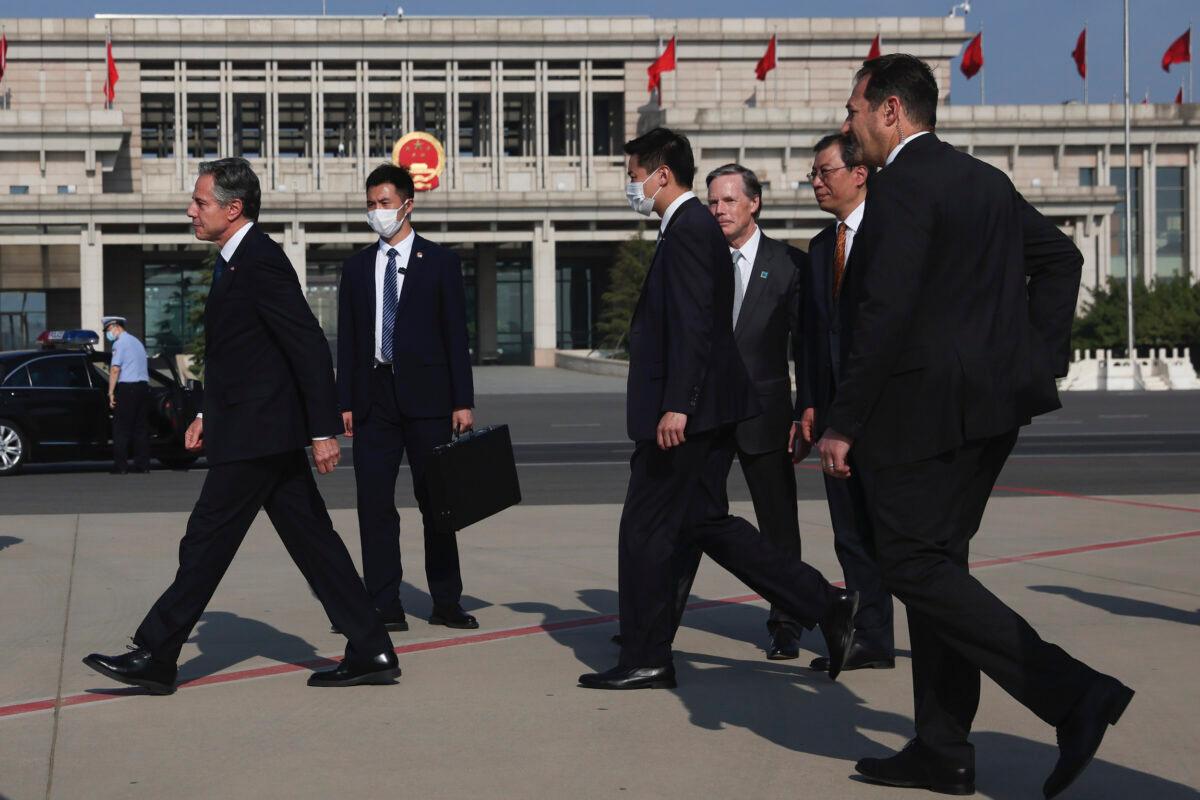 U.S. Secretary of State Antony Blinken (L) walks after arriving in Beijing, on June 18, 2023. (Leah Millis/Pool Photo via AP)