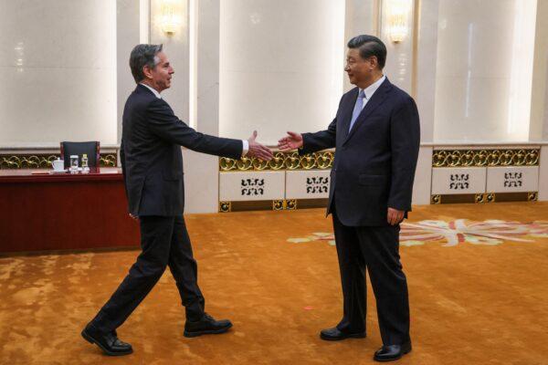 Secretary of State Antony Blinken (L) shakes hands with China's President Xi Jinping in the Great Hall of the People in Beijing on June 19, 2023. (Leah Millis/Pool/AFP via Getty Images)