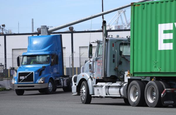 Trucks drive through the Port of Oakland in Oakland, Calif., on March 31, 2023. (Justin Sullivan/Getty Images)