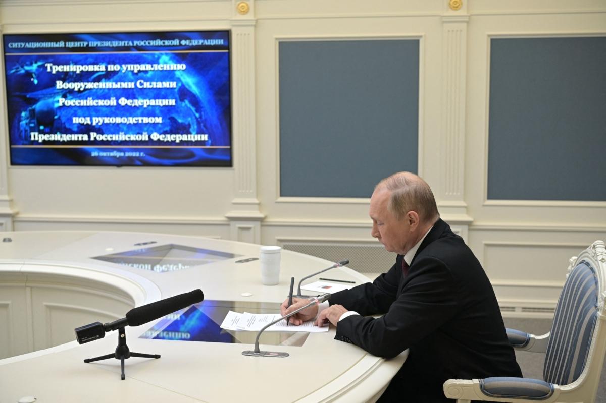 Russian President Vladimir Putin oversees the training of the strategic deterrence forces, troops responsible for responding to threats of nuclear war, via a video link in Moscow on Oct. 26, 2022. (Alexei Babushkin/Sputnik/AFP via Getty Images)