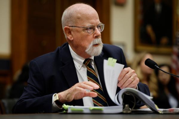Special Counsel John Durham leafs through his report while testifying to the House Judiciary Committee in the Rayburn House Office Building on Capitol Hill in Washington on June 21, 2023. (Chip Somodevilla/Getty Images)