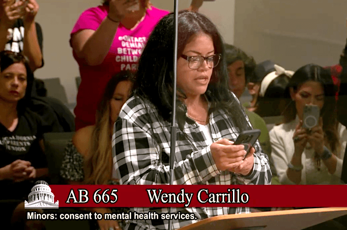 Wendy Minas, a Los Angeles mother of five children, speaks at a state Senate committee meeting in Sacramento on June 20, 2023. (Screenshot via Senate Judiciary Committee)