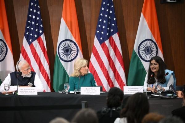 India's Prime Minister Narendra Modi (L) and U.S. First Lady Jill Biden listen to Anchal Sharma (R), a doctoral candidate at the Indian Institute of Technology, during a visit to the National Science Foundation in Alexandria, Virginia, on June 21, 2023. (Mandel Ngan/AFP via Getty Images)