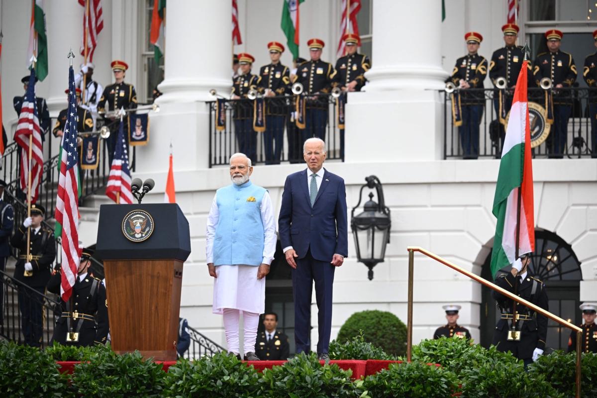 U.S. President Joe Biden and India's Prime Minister Narendra Modi (L) listen to the national anthems during a welcoming ceremony for Modi in the South Lawn of the White House in Washington on June 22, 2023. (Mandel Ngan/AFP via Getty Images)