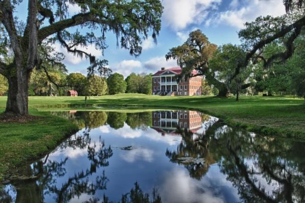 More than 360,000 bricks were hand-made on-site and used to construct Drayton Hall, which sits prominently on lands defined by massive oaks, dripping with moss, and a pond. The estate once comprised more than 76,000 acres where indigo, rice, and cattle were raised. (Drayton Hall Preservation Trust)