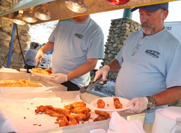 Staff serving fish and chips at the Lions Fish Fry and Carnival. (Courtesy of the Lions Club)<span style="font-size: 16px;"> </span>