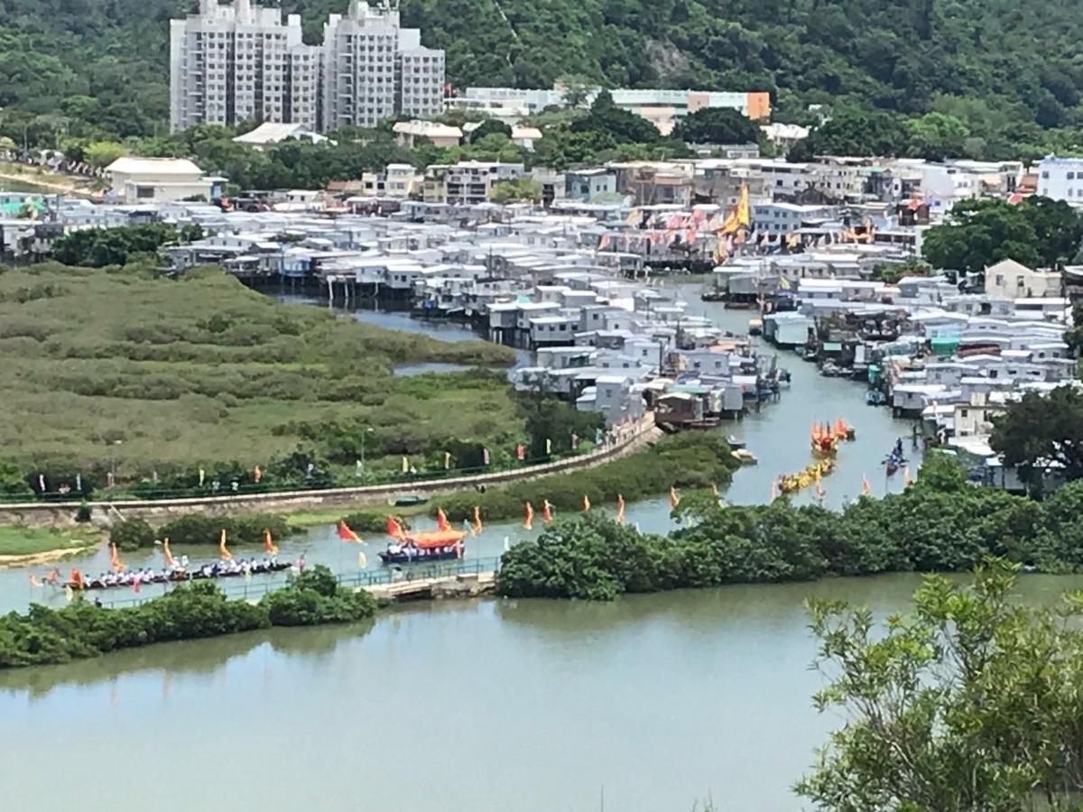 On June 22, 2023, during the Tai O Dragon Boat Water Parade, traditional dragon boats tow the Boat of God carrying Buddha statues parade in Tai O waterways to cleanse the community and pray for safety. (Courtesy of Wong Chi-keung)