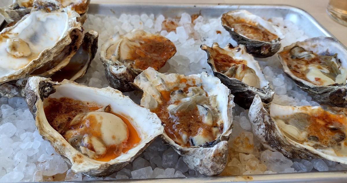 Grilled oysters in spicy chili butter are worth the trip to Finca in Paso Robles, California. (Courtesy of Jim Farber)