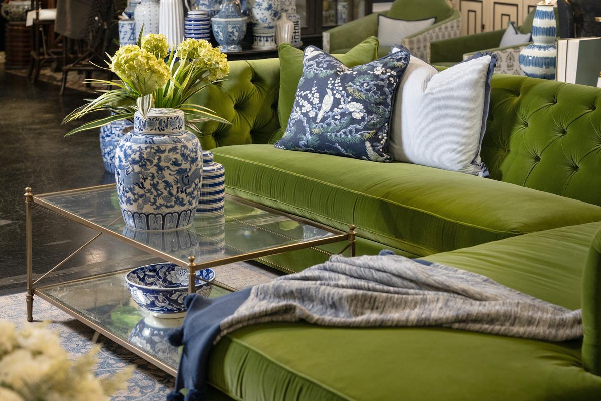 This rich velvet green sofa is the star of the Mullberry Drive room. Blue and white accessories make for a chic and subdued pairing to this green sofa. (Handout/TNS)