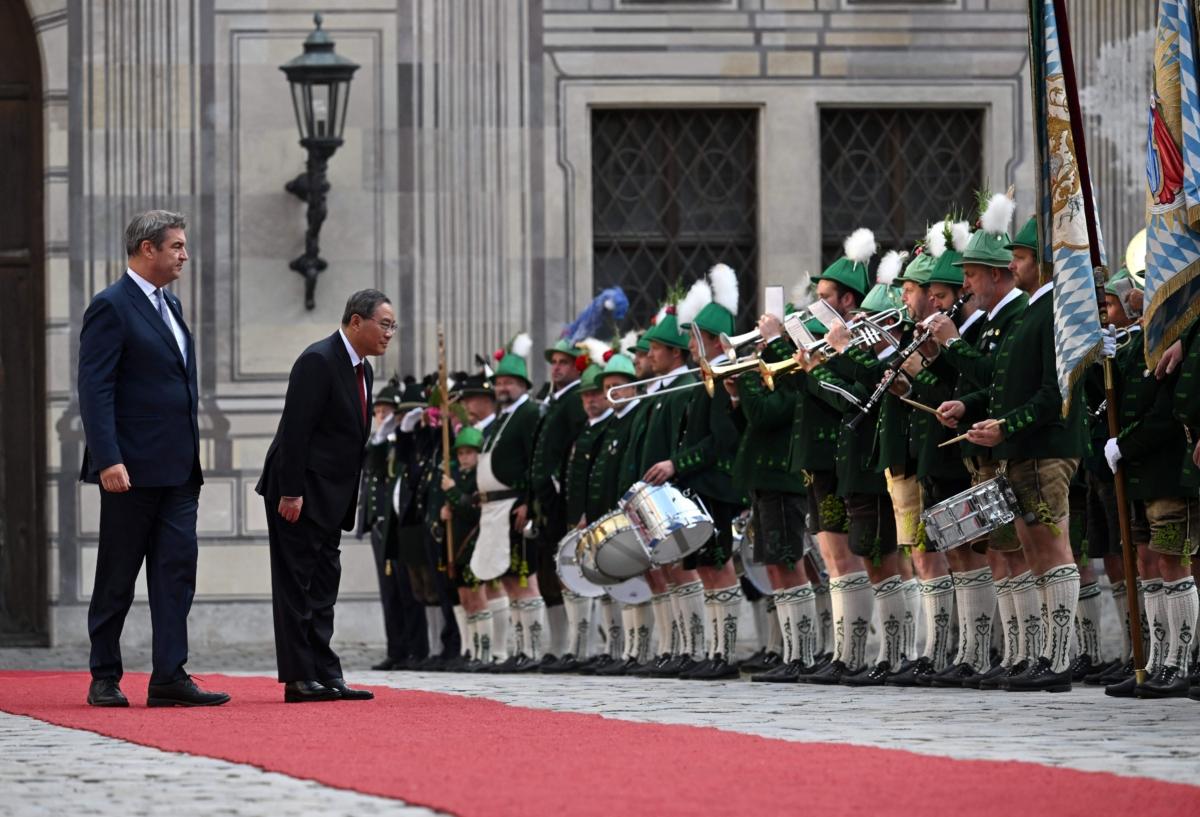 Bavaria's State Premier and leader of the Christian Social Union (CSU) party Markus Soeder and China's Premier Li Qiang review an honor guard of Bavarian mountain riflemen at the Residenz, the former royal palace of Bavaria's Wittelsbach monarchs, in Munich, southern Germany, on June 20, 2022. (Christof Stache/AFP via Getty Images)