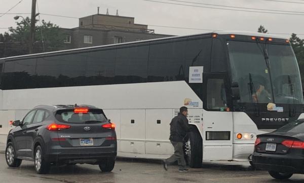 One of the buses taking protest participants to Ottawa, preparing to depart from the North York area of Toronto on the morning of June 24, 2023. (The Epoch Times)