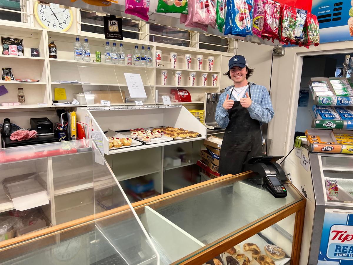 Jack Wells shows off freshly baked pastries at the Chocolate Éclair Shop, a favorite stop for locals and tourists alike, in the small New Zealand town of Okahune. (Mary Ann Anderson/TNS)