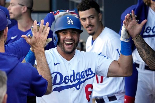 Los Angeles Dodgers' David Peralta is congratulated by teammates in the dugout after hitting a two-run home run during the seventh inning of a baseball game against the Houston Astros in Los Angeles on June 24, 2023. (Mark J. Terrill/AP Photo)