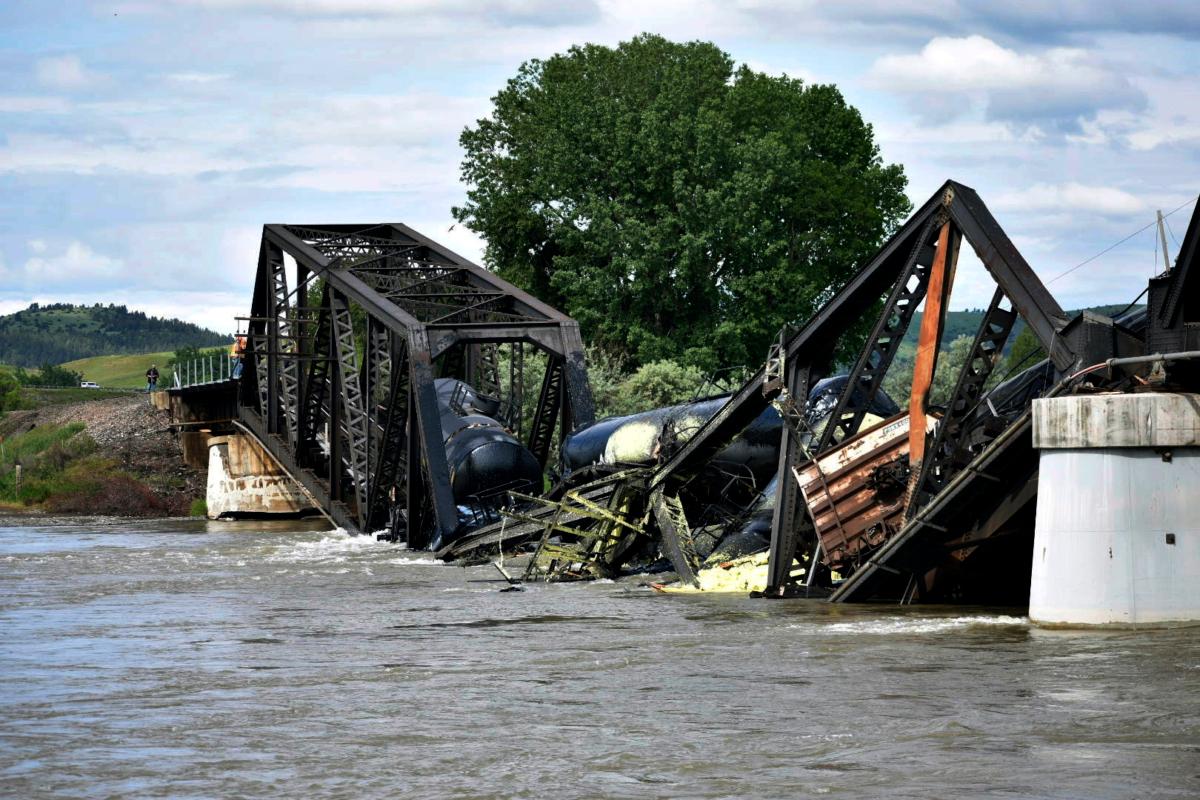 Several train cars are immersed in the Yellowstone River after a bridge collapse near Columbus, Mont., on June 24, 2023. (Matthew Brown/AP Photo)