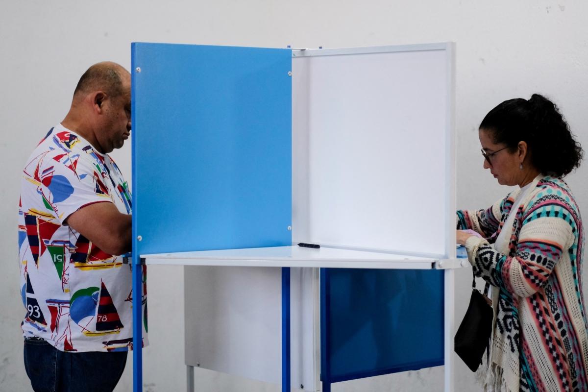 People attend voting at a polling station during the first round of Guatemala's presidential election in Guatemala City, Guatemala, on June 25, 2023. (Josue Decavele/Reuters)