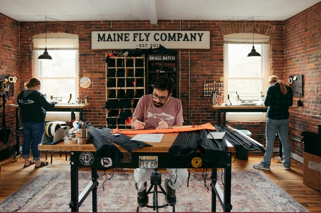 Owner and founder Jeff Davis (center) and some builders working on custom rods in Maine Fly Co.'s Yarmouth, Maine, retail shop. (Maine Fly Co.)