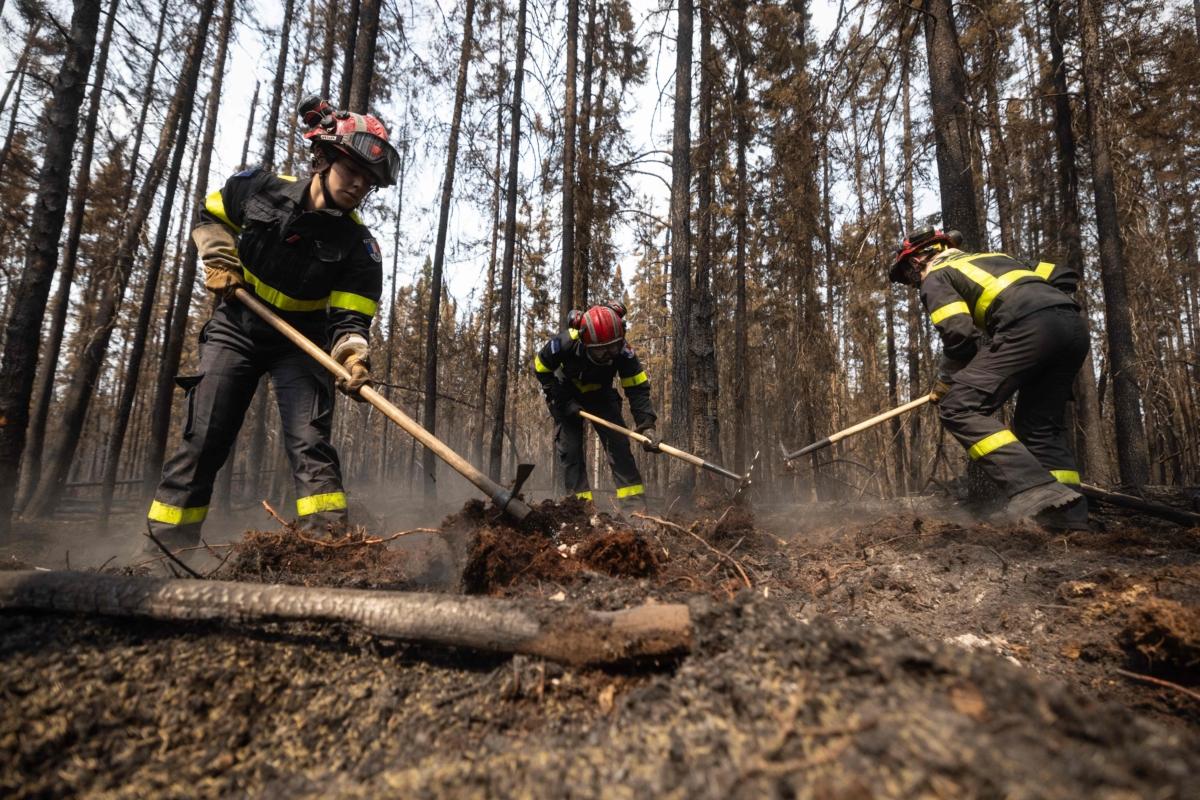 French firefighters battle fires north from the city of Chibugamau, Quebec, Canada, on June 12, 2023. Quebec has deployed hundreds of firefighters, with help from France and the United States, as Canada is hit hard by unprecedented wildfires that have ravaged the country. (Quentin Tyberghien /AFP via Getty Images)