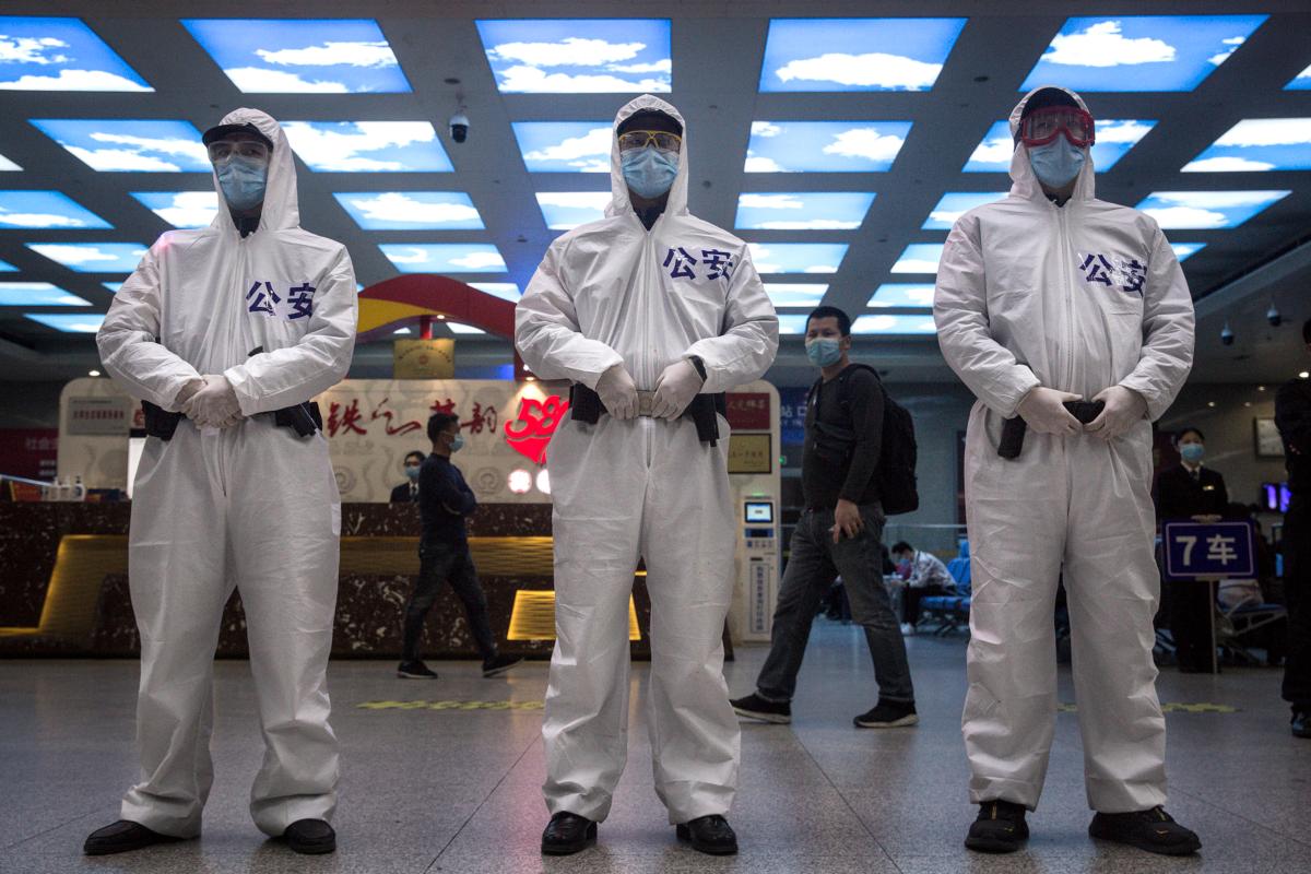 Railway police are on duty in the waiting room in Wuhan, Hubei Province, China, on April 7, 2020. (Getty Images)