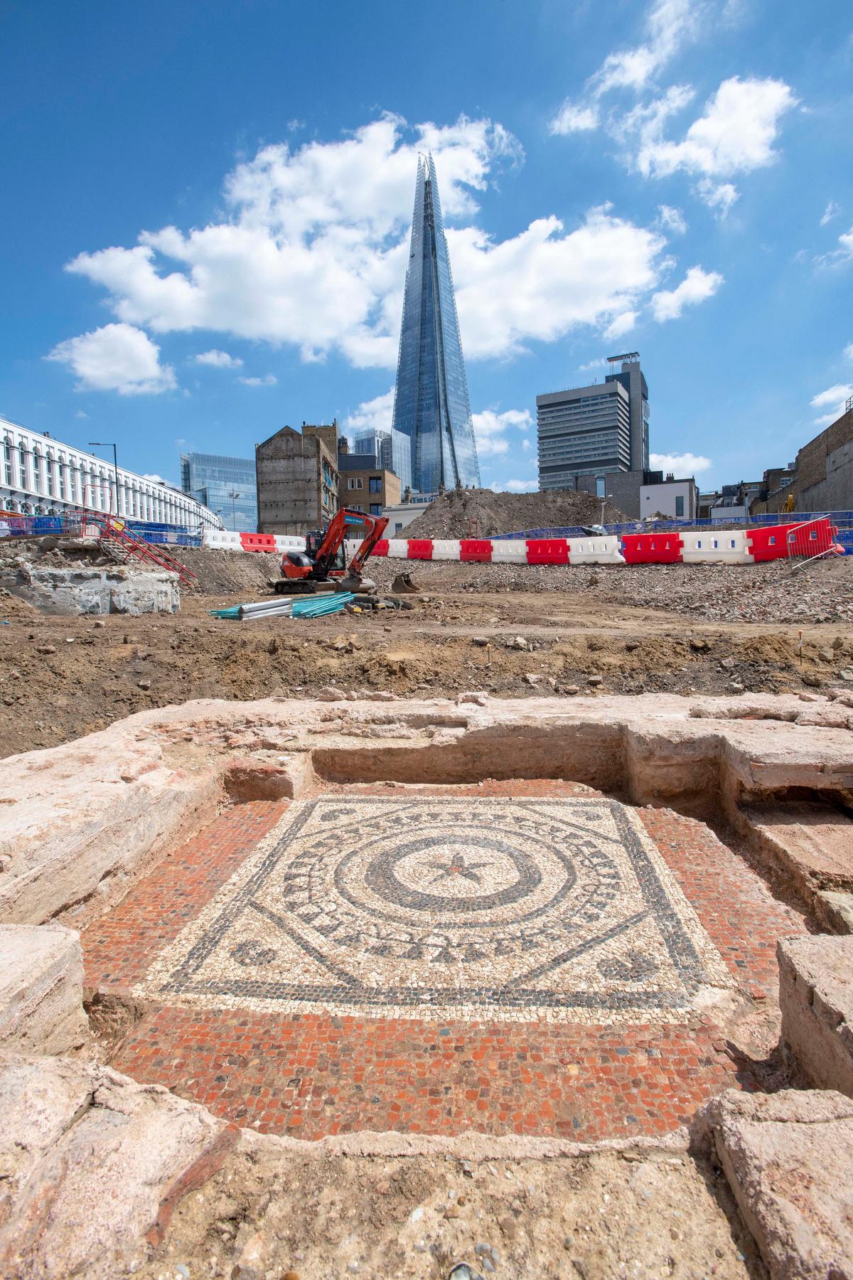 A Roman mosaic in a Roman mausoleum is seen below the City of London skyline. (© MOLA)