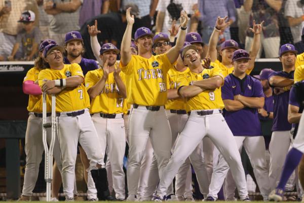 LSU's Brayden Jobert (6) is greeted after his 2-run homer in the 9th inning of Game 3 of the NCAA College World Series baseball finals against Florida in Omaha, Neb., on June 26, 2023. (Rebecca S. Gratz/AP Photo)