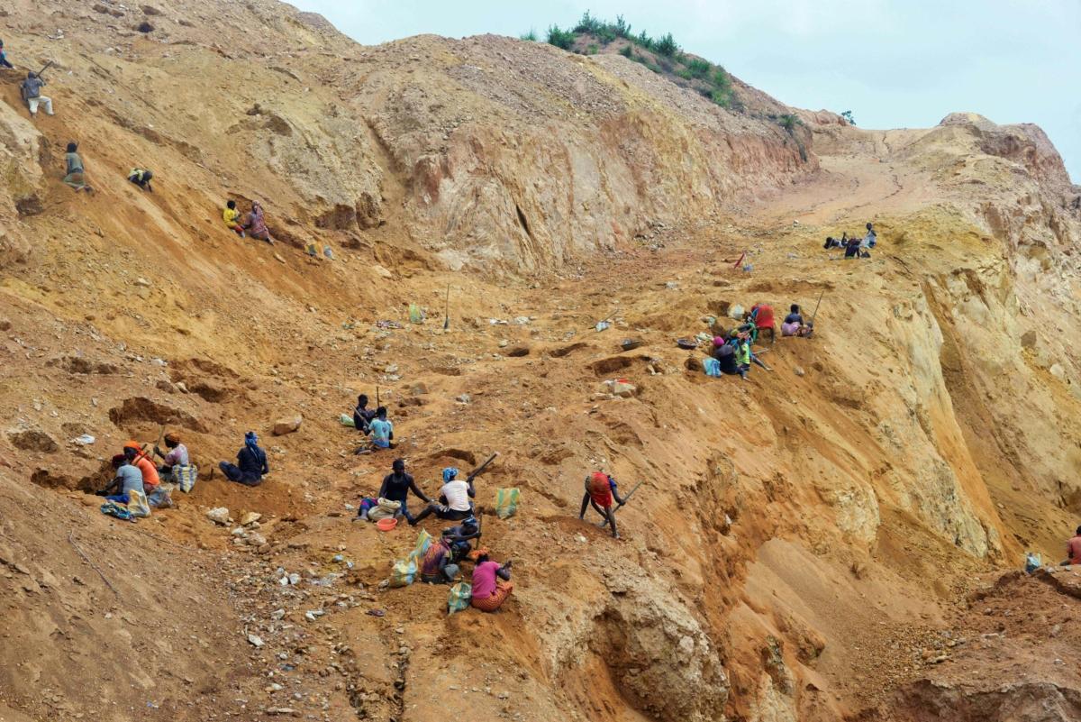 Gold miners dig at a mining site in the Cameroon town of Betare Oya on April 4, 2018. (Reinnier Kaze/AFP via Getty Images)