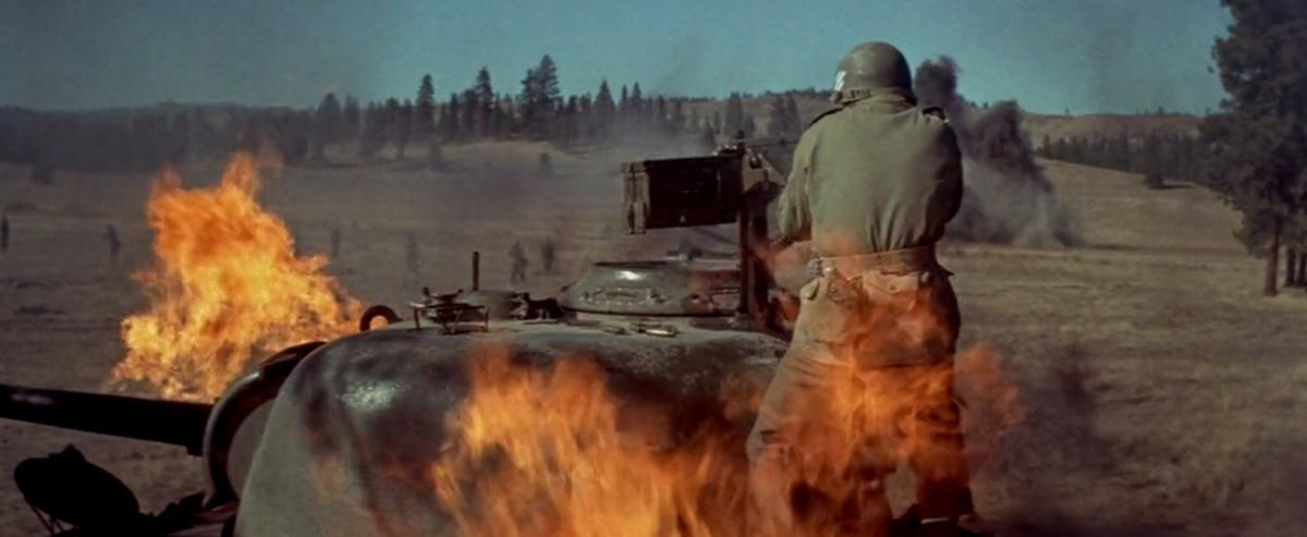 Standing in open fire, Murphy’s daring action singlehandedly broke up the German attack. (Universal Pictures)