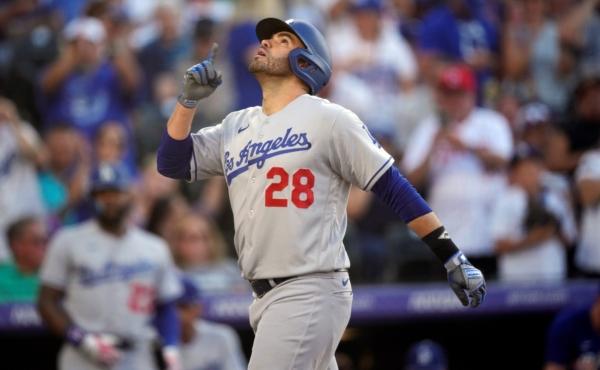 <br/>Los Angeles Dodgers' J.D. Martinez gestures as he crosses home plate after hitting a two-run home run against Colorado Rockies starting pitcher Connor Seabold in the third inning of a baseball game in Denver on June 27, 2023. (David Zalubowski/AP Photo)
