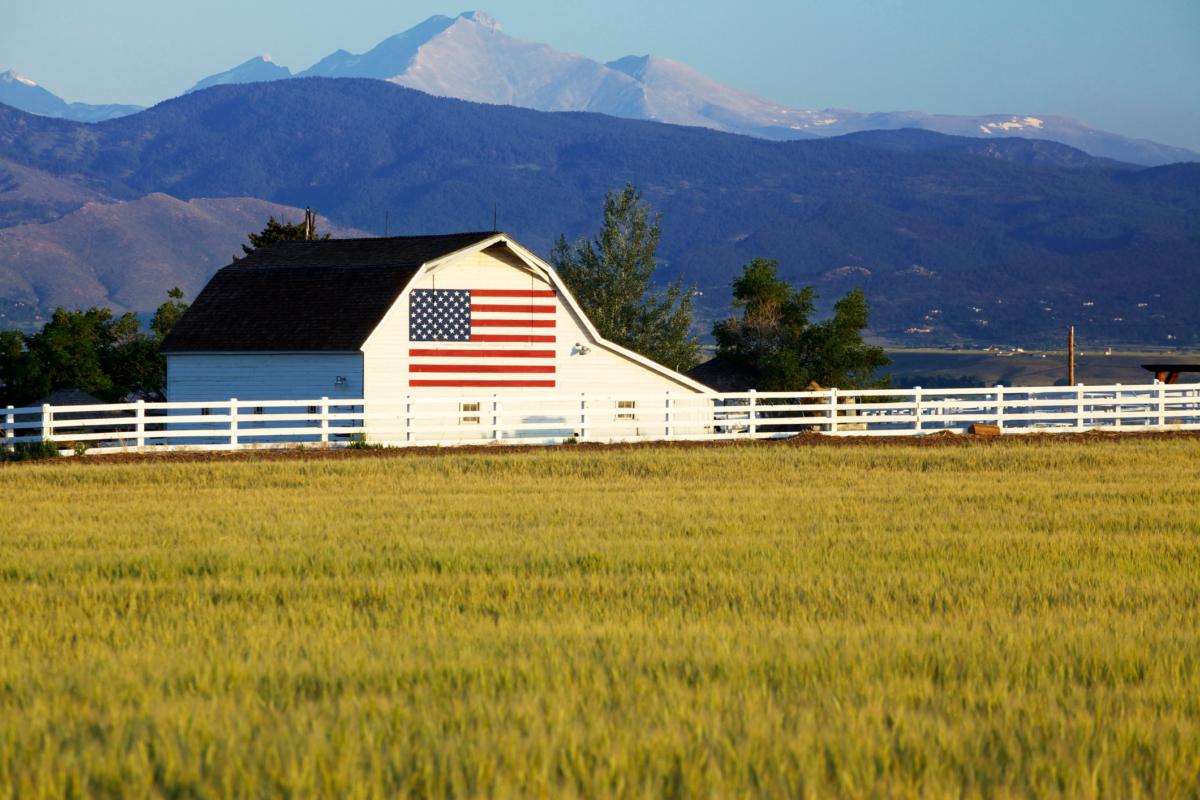 Flag painted on the side of a barn in the Rocky Mountains. (Beklaus/Getty Images)