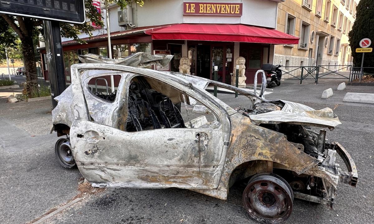 A car, burnt during clashes between youths and police, in a street the day after the death of a 17-year-old teenager killed by a French police officer during a traffic stop, in Nanterre, Paris suburb, on June 28, 2023. (Antony Paone/Reuters)