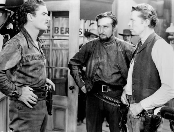 (L–R) Wade Hatton (Errol Flynn), Yancy (Victor Jory), and Jeff Surrett (Bruce Cabot), in “Dodge City." (MovieStillsDB)